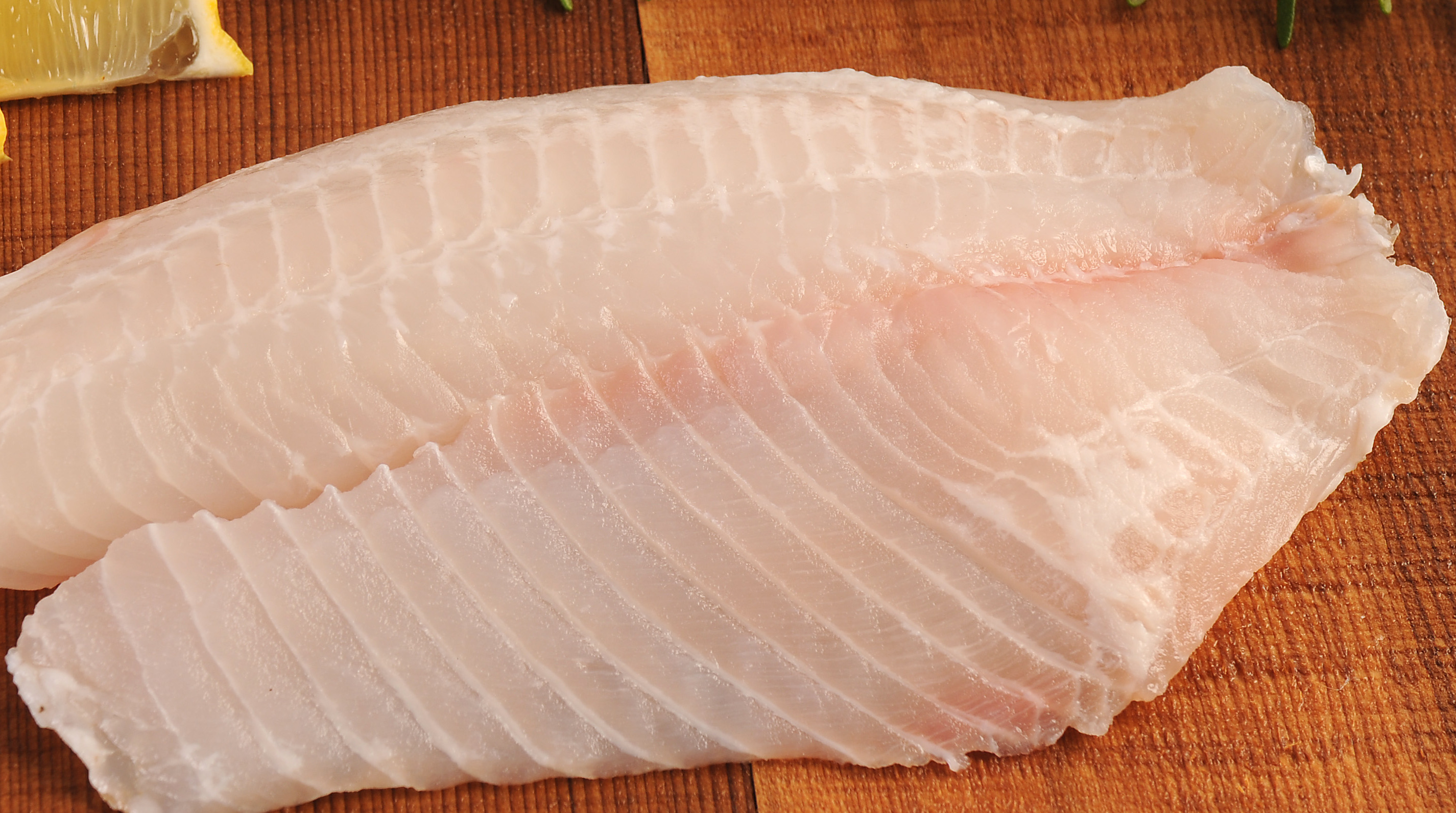 Image of a white fish fillet on a cutting board